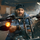 Handsome bearded man testing new motorbike in garage store - PhotoDune Item for Sale
