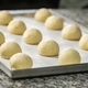 Balls of Dough Placed On a Cooking Paper in a Baking Pan - PhotoDune Item for Sale