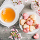 Macarons or French macaroons in heart shapes with tea with cherry blossom petals for Mothers Day - PhotoDune Item for Sale