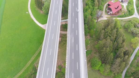 Aerial Top View of Highway Viaduct with Multilane Traffic in Mountains, Autobahn in Austria alt