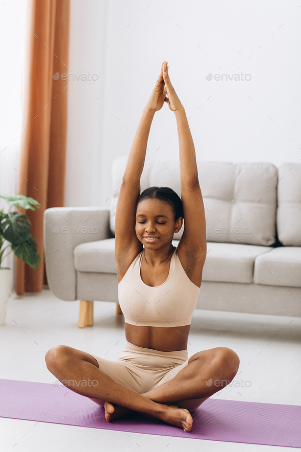 Young black woman meditating at home, yoga online concept, free space Stock  Photo by anatoliycherkas