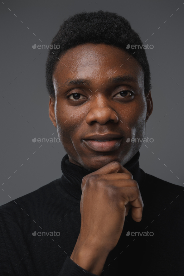 African Guy With Black Turtleneck Sweater Looking At Camera Stock Photo 