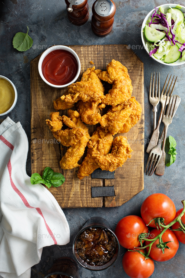 Breaded chicken tenders with ketchup Stock Photo by fahrwasser PhotoDune