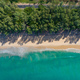 Aerial view of road in beautiful green forest with wave crushing beach and sea, topview from drone. - PhotoDune Item for Sale