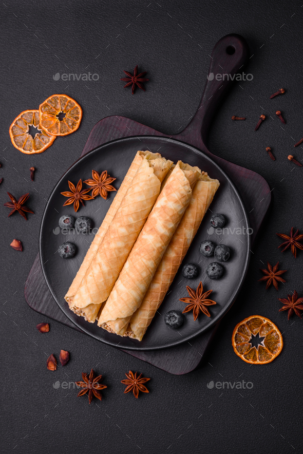 Delicious crispy wafer rolls with cream filling with nuts Stock Photo