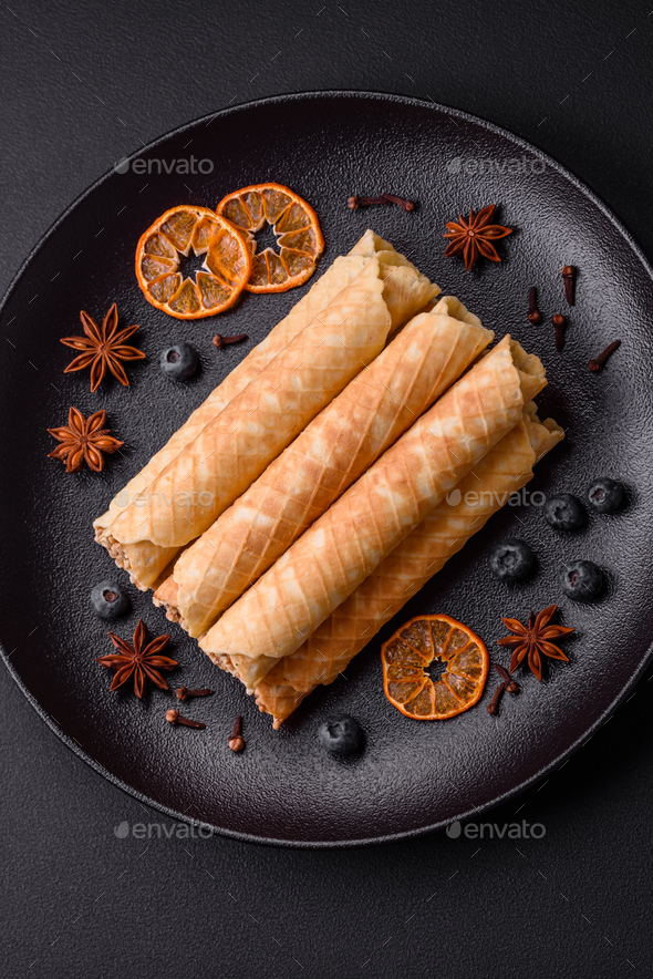 Delicious crispy wafer rolls with cream filling with nuts Stock Photo