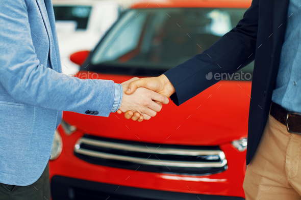 Close-uo of shaking hands after a successful car buying Stock Photo by ...