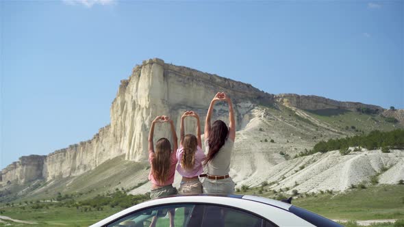 Mother and Little Daughters on Summer Car Vacation