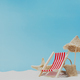 Vacation, beach, travel concept. Composition with lounger, chair, bag on sand - PhotoDune Item for Sale