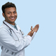 Portrait of male indian doctor showing copy space. - PhotoDune Item for Sale