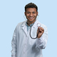 Smiling young indian man doctor holding a stethoscope. - PhotoDune Item for Sale