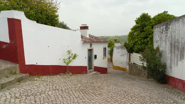 Houses of Castle of Óbidos that are Painted with Blue Red and Yellow Colours