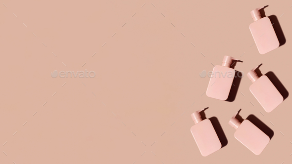 Pattern pink cosmetic product layout with a place for a logo on a pink. Shampoo. Banner6 copy space.
