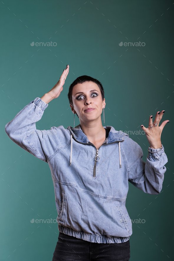 Upset angry woman gesturing nervous and screaming during studio shot ...