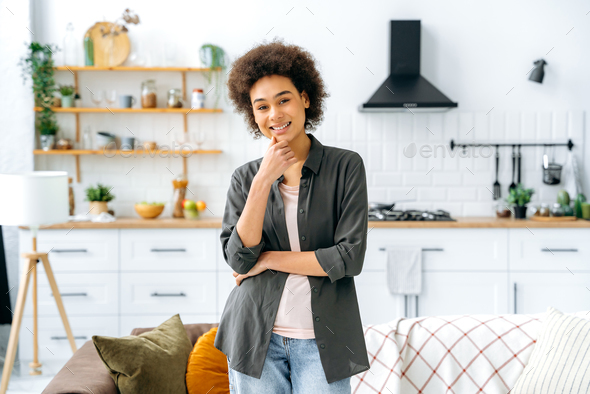 Photo Of A Beautiful Positive Stylishly Dressed Curly Haired African