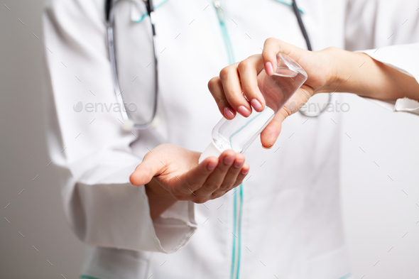 Doctor uses an antiseptic to disinfect the hands