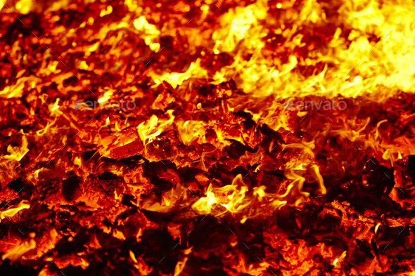 Fire volcano incandescent material. Hot charcoal bonfire. Carbon emissions