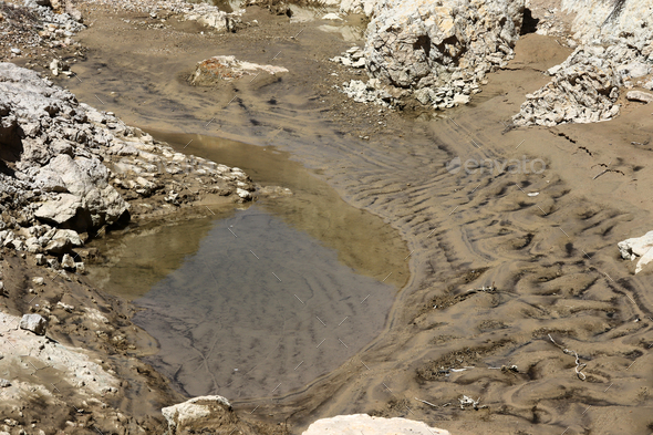 Puddle of rain water. Still water. Stock Photo by safakc1 | PhotoDune