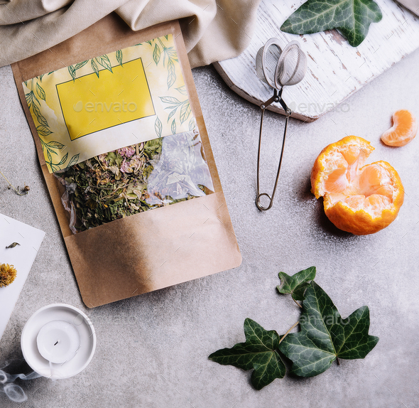 cup of tea with tangerines and tea packaging