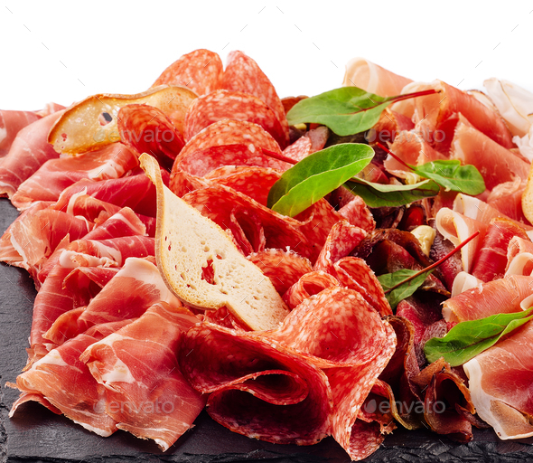 Traditional spanish jamon, prosciutto crudo, italian salami, parma ham