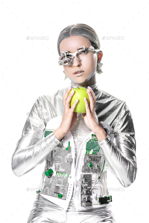 silver robot holding apple and looking at camera isolated on white, future technology concept