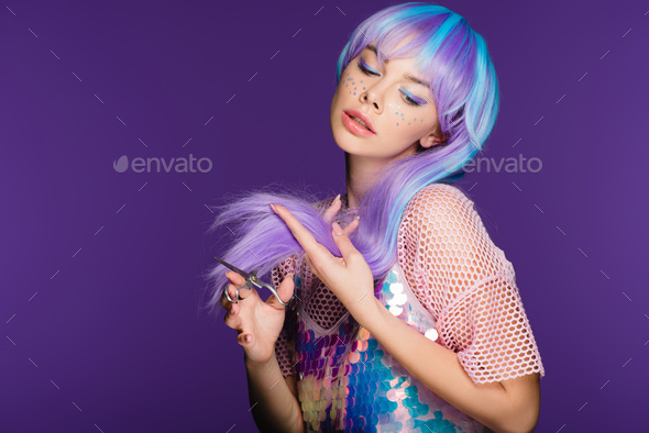 fashionable girl with stars on face cutting violet hair with scissors,  isolated on purple Stock Photo by LightFieldStudios