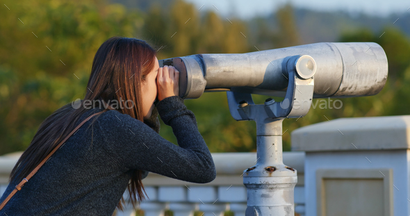 Tourist look at the binocular Stock Photo by leungchopan | PhotoDune