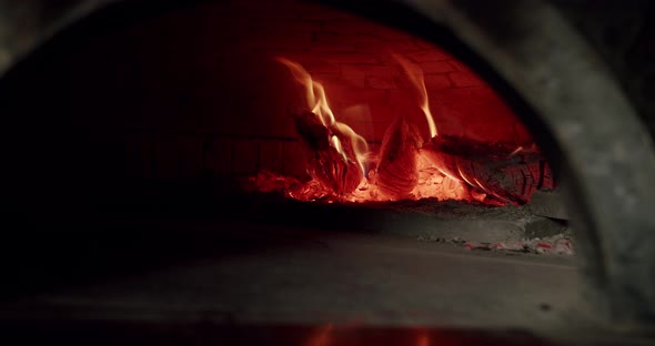 Fire Burn Wood Super Slow Motion. Ready to prepare Italian Pizza. Kitchen Oven. alt