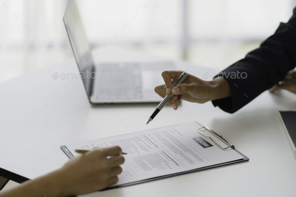 New graduate woman filling out an application form for HR department Review