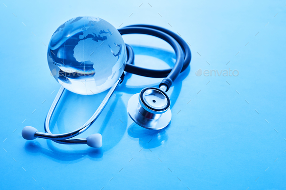 World Health Day. Global Health Awareness Concept. Globe and Stethoscope on blue background.