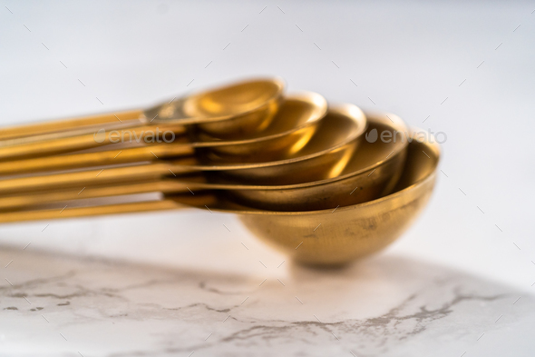 Measuring cups and spoons Stock Photo by arina-habich