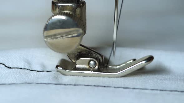 Slow motion of old sewing machine showing process