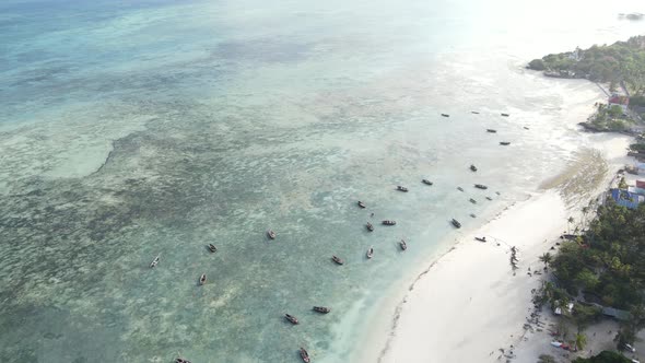 Coastal Landscape of Zanzibar Tanzania  Boats Near the Shore alt