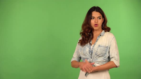 A Young Beautiful Caucasian Woman Acts Upset  Green Screen Background