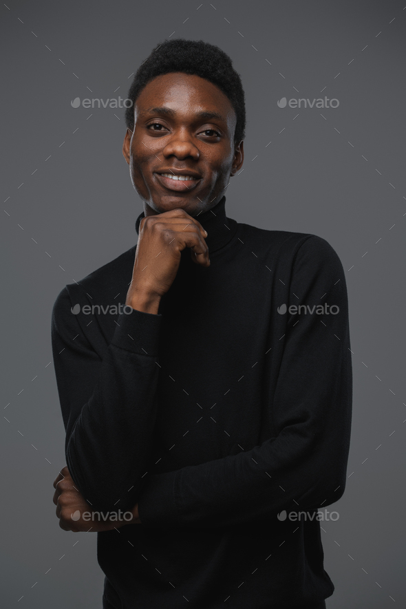 African Guy With Black Turtleneck Sweater Looking At Camera Stock Photo 