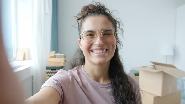 Portrait of Cheerful Asian Homeowner Making Online Video Call Discussing New Apartment alt