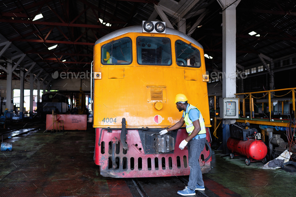 Train maintenance engineer check front of train below one engineering check in operation room