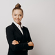 Woman executive in dark suit standing sideways - PhotoDune Item for Sale