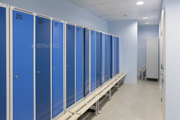 Sports and exercise facilities indoors in a gym, changing rooms, lockers with blue doors.