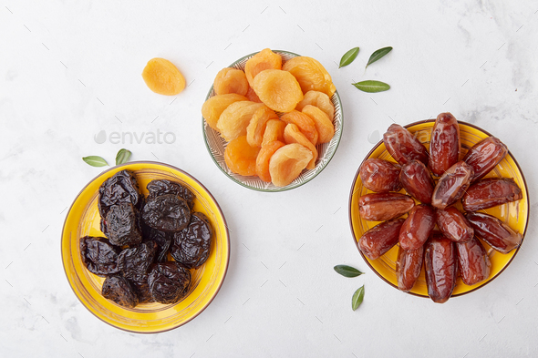 Healthy snacks - prunes, dried apricots, dates top view