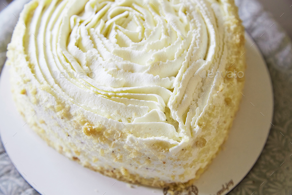 Heart shaped wedding cake with white creamy texture. Healthy, gluten free vegan cake