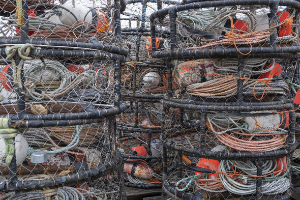 A quayside heap of commercial crab pots and nets, rope and floats. Stock  Photo by Mint_Images