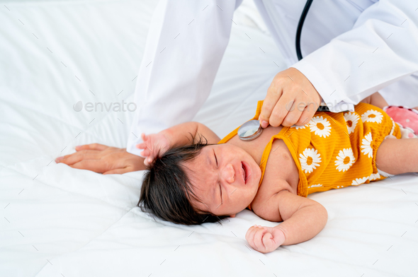 The Doctor Use Stethoscope To Check The Symptom Of Newborn Baby Cry And ...