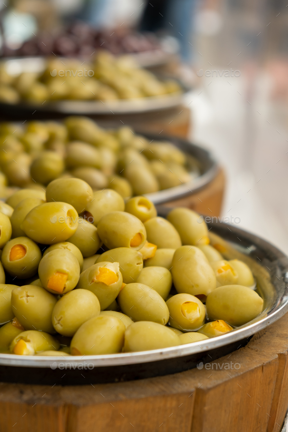Different marinated olives and local food on street market in Gdansk, Poland. Selling and buying - Stock Photo - Images