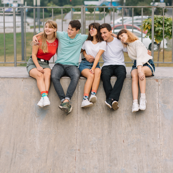 Group of Smiling Teenagers Hanging Out Stock Image - Image of