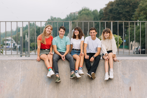 Group of Smiling Teenagers Hanging Out Stock Image - Image of