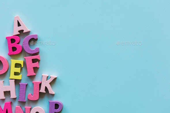learn english language. alphabet abc letters on blue background with copy space