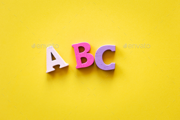 learn english language. letters abc on yellow background.
