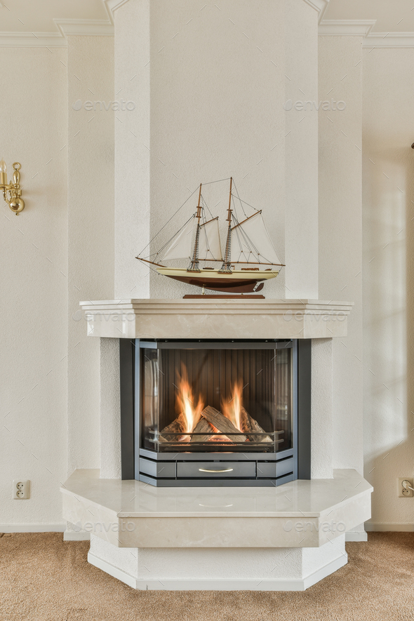 a fireplace with a ship on top of it