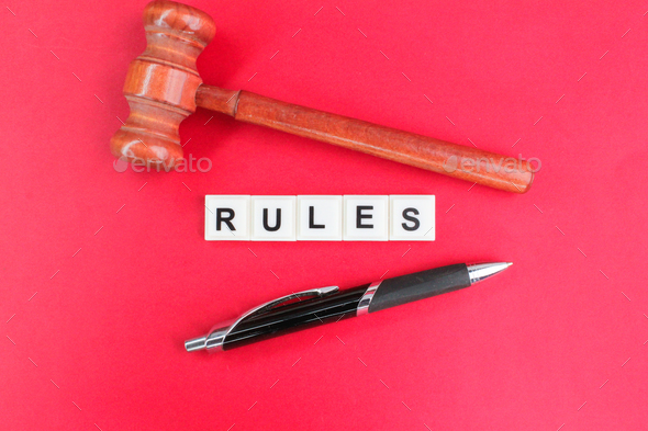 judge's pen and gavel with the word rule.  - Stock Photo - Images